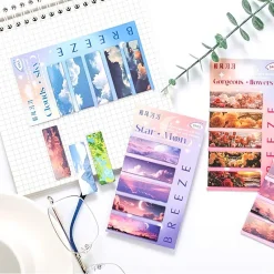 Bộ 5 bookmark nam châm với các mẫu thiết kế khác nhau, bao gồm mây trời, hoa tươi và phong cảnh.